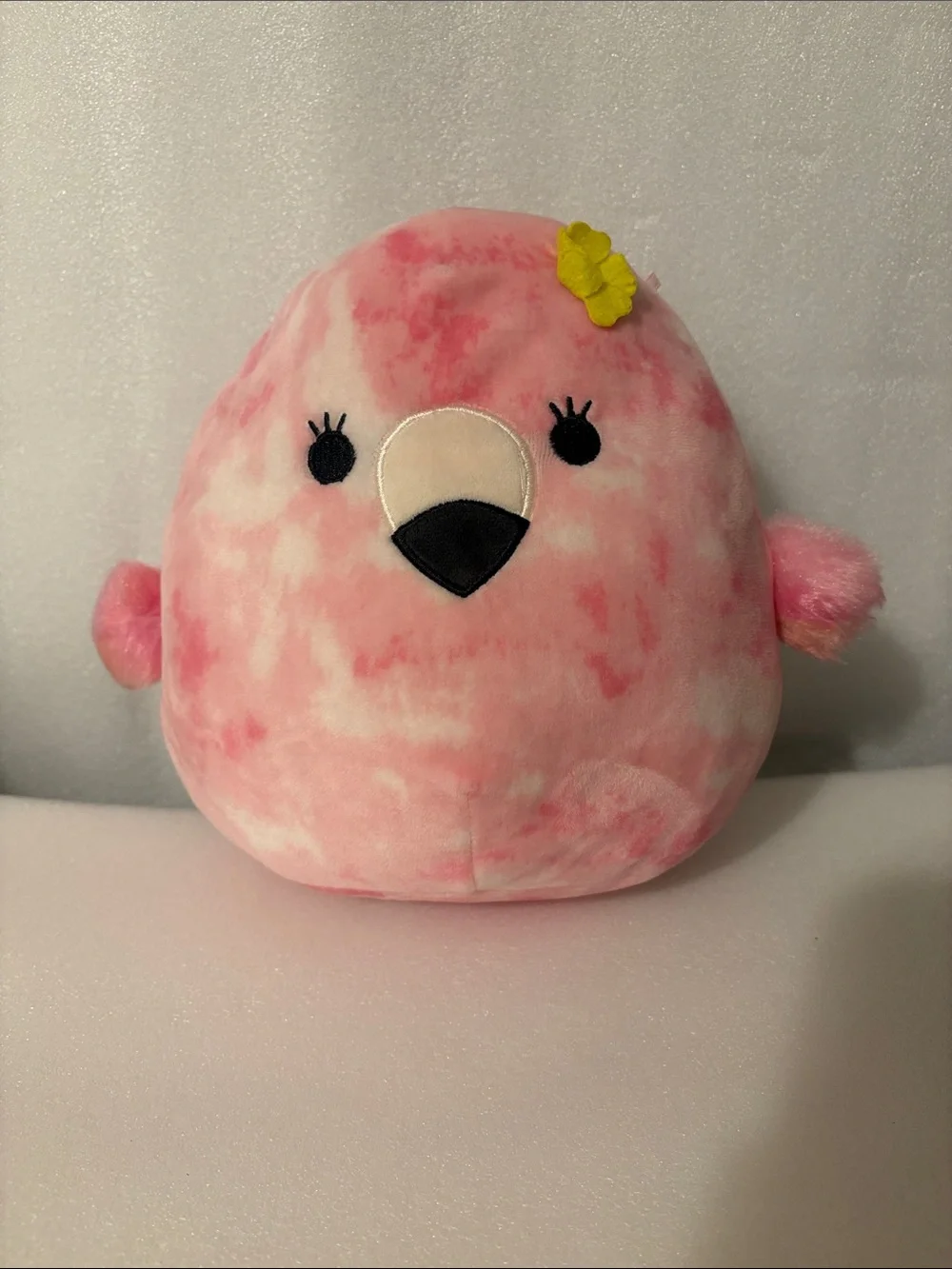 Squishmallows Pink Tie-Dye Bird with Yellow Flower Accent